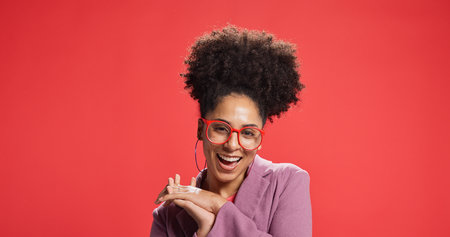 Excited, woman and smile with glasses, portrait or fashion designer with pride or studio background. Confident, stylist and African person with opportunity for startup, mockup space and eyewearの写真素材