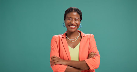 Black woman, portrait and business owner in studio with confidence, fashion designer and happy. Entrepreneur, arms crossed and smile on green background space for about us, brand clothing and startupの写真素材