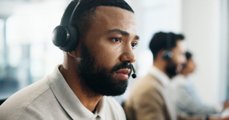 Serious, profile and man in call center for technical support, IT solution or coworking. Headset,...
