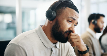 Burnout, headache and thinking with man in call center for help or solution as virtual assistant....