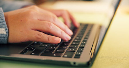 Laptop, research and hands of businessperson typing in office at night with review for creative...