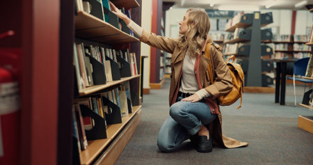 Student, university and woman in library, search and books with education, research and study....