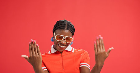 Happy, portrait or black woman with fashion accessories in studio for style on a red background....