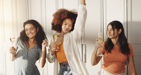Women, friends and dancing in home with champagne, happy and bonding with cheers for reunion....