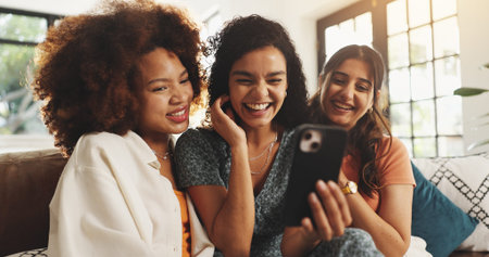 Phone, laughing and relax with friends on sofa for support, bonding and social media together. Post...