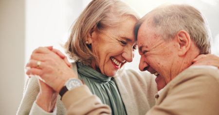Love, dance and smile with old couple in home for romance, bonding and anniversary. Holding hands, support and trust with elderly man and woman for connection, retirement and solidarity togetherの写真素材