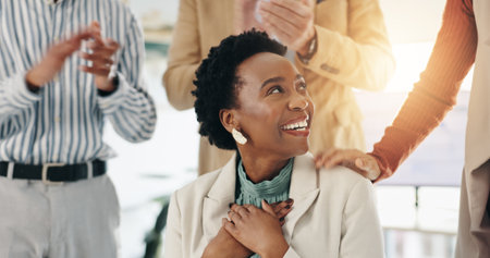 Applause, success and businesswoman with promotion, congratulations or praise for goal achievement. Clapping hands, happy team and celebration for support, career recognition and well done in officeの写真素材