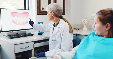 Child, teaching and dentist with teeth on screen for help, surgery information or diagnosis....
