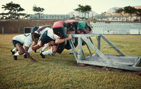 Equipment, rugby and training with team of people outdoor on field together for competition or challenge. Exercise, performance drill and sport with player group on grass for start of fitness routineの写真素材