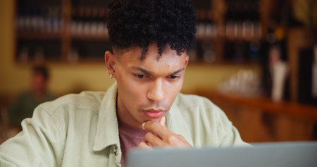 Man, thinking and laptop with idea in coffee shop for small business vision or startup. Male person,...