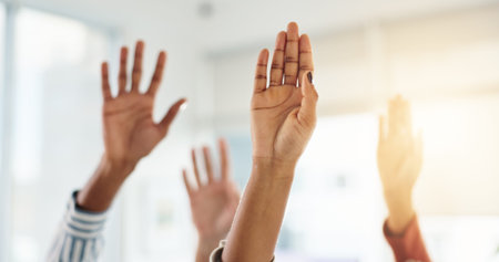 Hands raised, question and business people in office at meeting, training or employee development....
