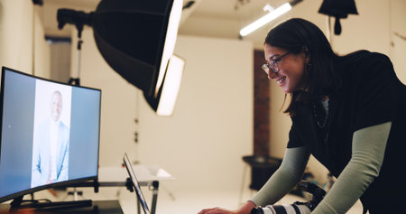 Computer, photographer and woman in studio with results for editing, image selection and process. Photography, creative set and person with model on tech for post production, planning and designの写真素材