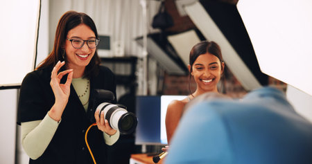 People, photographer and smile with model for photoshoot, planning and backstage. Women, technology...