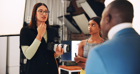 People, photographer and direction with model for photoshoot, planning and backstage. Women, technology and camera for filming production, videography and photography internship for digital agencyの写真素材