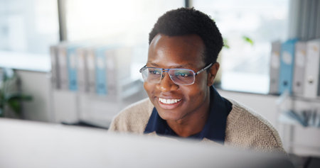 Computer, glasses and black man in office with research, reading or email for finance report....