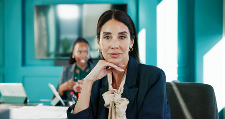 Accounting, consultant and portrait of business woman at desk in office for finance or investment. Corporate, serious and trading with mature employee in workplace for financial or wealth managementの写真素材