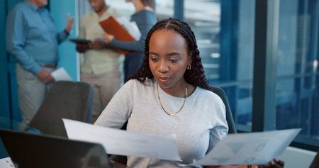 Office, laptop and woman with paperwork, planning and accountant for financial report and graphs....
