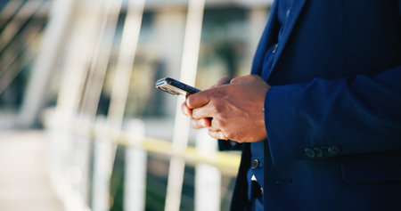 Hands, phone and business black man in city for networking, contact and online connection....