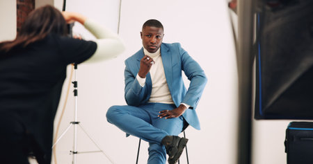 Model, photography and photoshoot with man in studio business fashion, about us and profile picture. Professional branding, style shooting and behind the scenes with people on set for productionの写真素材