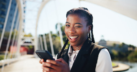 Businesswoman, phone and wink in portrait, city or smile for chat, playful or post on commute to...