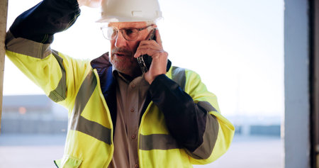 Contractor, man and talking with phone call on site for building inspection, feedback or progress....