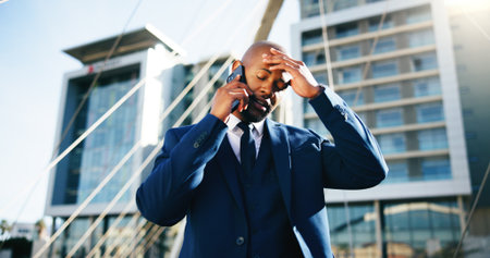 Phone call, stress and business with black man in city for permit rejection, contact and property fail. Final notice, communication and anxiety with person outdoor for real estate crisis and worryの写真素材