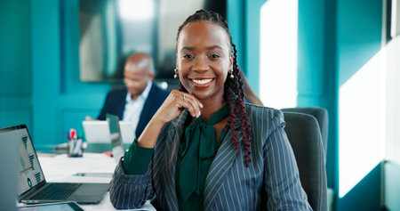 Accounting, portrait and smile of business black woman at desk in office for finance or investment. Corporate, laptop and trading with happy employee in workplace for financial or wealth managementの写真素材
