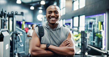 Happy, crossed arms and portrait of black man in gym for workout, fitness or exercise for wellness....