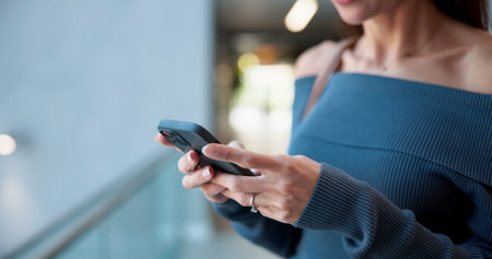 Convention center, hands and phone with business woman in lobby for email update or text message....