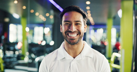 Gym manager, happy and man with portrait for membership service, fitness career and confidence. About us, professional and smile at sports club for customer satisfaction and equipment maintenanceの写真素材