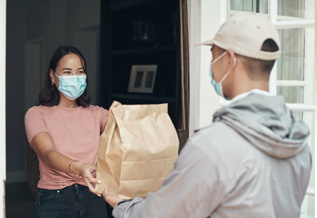 Woman, face mask and happy for shipping product delivery, cargo and for safety. Customer, logistics and package transport for covid 19, courier and stock with distribution for healthy serviceの写真素材