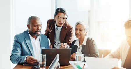 Advice, research and laptop with business people in office for trading, broker training or teamwork. Stock market report, investment solution and coaching with employees in agency for economy analystの写真素材
