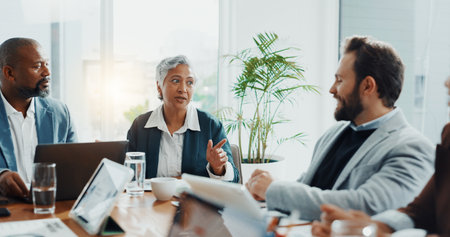 Teamwork, meeting and speaker with business people in office for budget report, stakeholder update and research. Ceo review, market analyst and partnership with employees in agency for discussionの写真素材