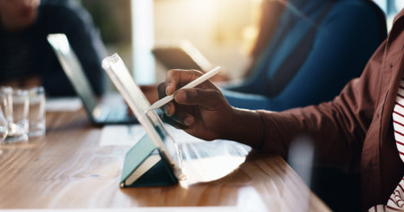 Hands, pen and tablet with graphic designer at desk in coworking office for creative development. App, design and writing with business person in workplace for website illustration or planningの写真素材