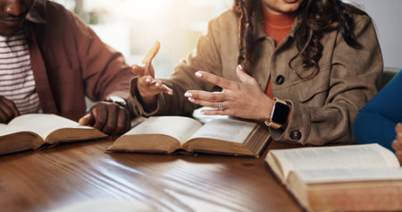 Hands, explain and girl with group for Bible study, worship or learning gospel for religion. Faith, Christianity and knowledge of God, scripture or theology talk for guidance with spiritual growthの写真素材
