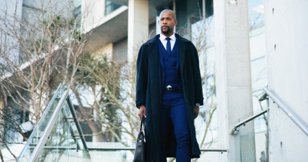 Morning, employee and man on trip, stairs or rush to work in city, commuting and attorney with case. Thinking, lawyer and black person in hurry for trial, serious and journey to court and reflectionの写真素材