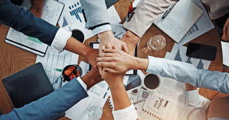 Hands, stack and above at meeting with documents, finance, support and team work at office. Business...