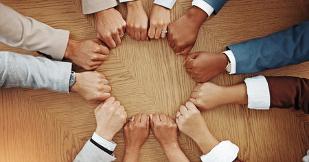 Teamwork, circle and hands of business people with fist bump for solidarity, agreement and...