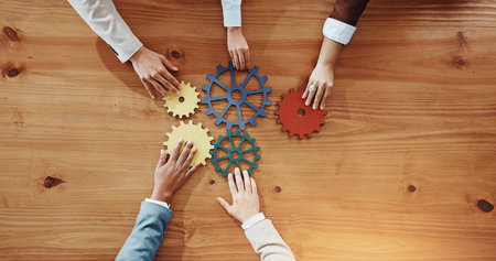 Business people, hands or cogs with gears for team building or problem solving. Top view, group or...
