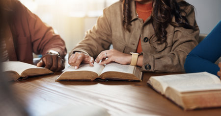 Hands, reading and group for Bible study, worship or people learning gospel for religion. Faith, Christianity and knowledge about God, scripture or theology text for guidance with spiritual growthの写真素材