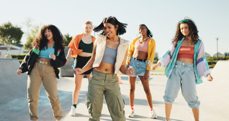Happy, dancing and girl friends in city with music for hip hop, fashion or talent with freestyle. Smile, fun and group of people with energy for moving to song together for practice outdoor in town.の写真素材