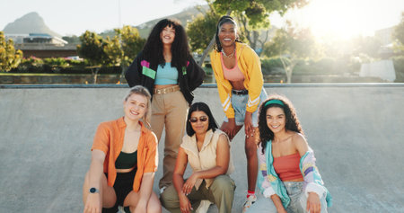 Fashion, portrait and smile of women outdoor at park together in retro streetwear as dance crew. Community, diversity and urban style with group of dancer friends in clothes outfit for city bondingの写真素材
