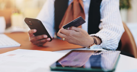 Business woman, hands and phone with credit card for online shopping, purchase or banking at office....