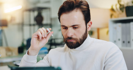 Thinking, stylus and tablet with business man in office for planning, research and schedule appointment. Application solution, problem solving and reflection with person in agency for report insightの写真素材