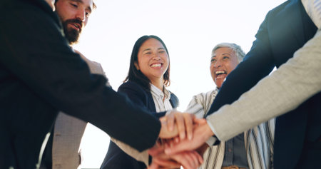 Business people, hands stack and happy at office for motivation, goals and success at company. Men,...