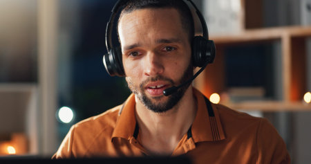 Man, call center and headset for communication at night for advice, help desk and freelance customer...