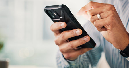 Business person, hands and research with phone in office for social media, software or update....