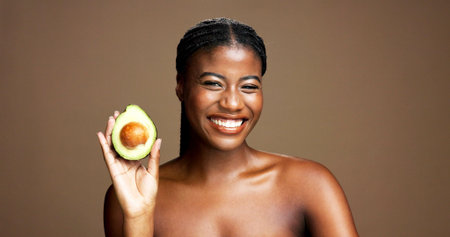 Beauty, avocado and portrait of black woman in studio with natural, antioxidants or face glow....