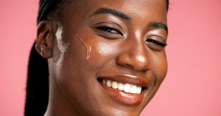 Portrait, facial treatment and black woman with serum, skincare and beauty for healthy skin or glow....
