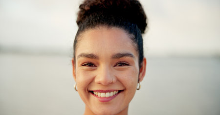 Portrait, smile and woman for travel outdoor for vacation, weekend break and adventure trip. Face, happy and space with female person on holiday, proud tourist and positive attitude of abroad getawayの写真素材